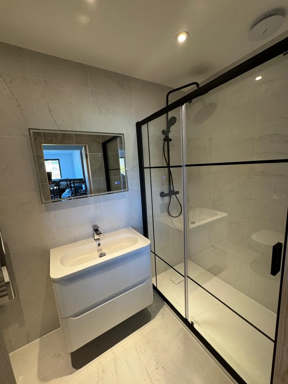 Completed marble-effect shower room