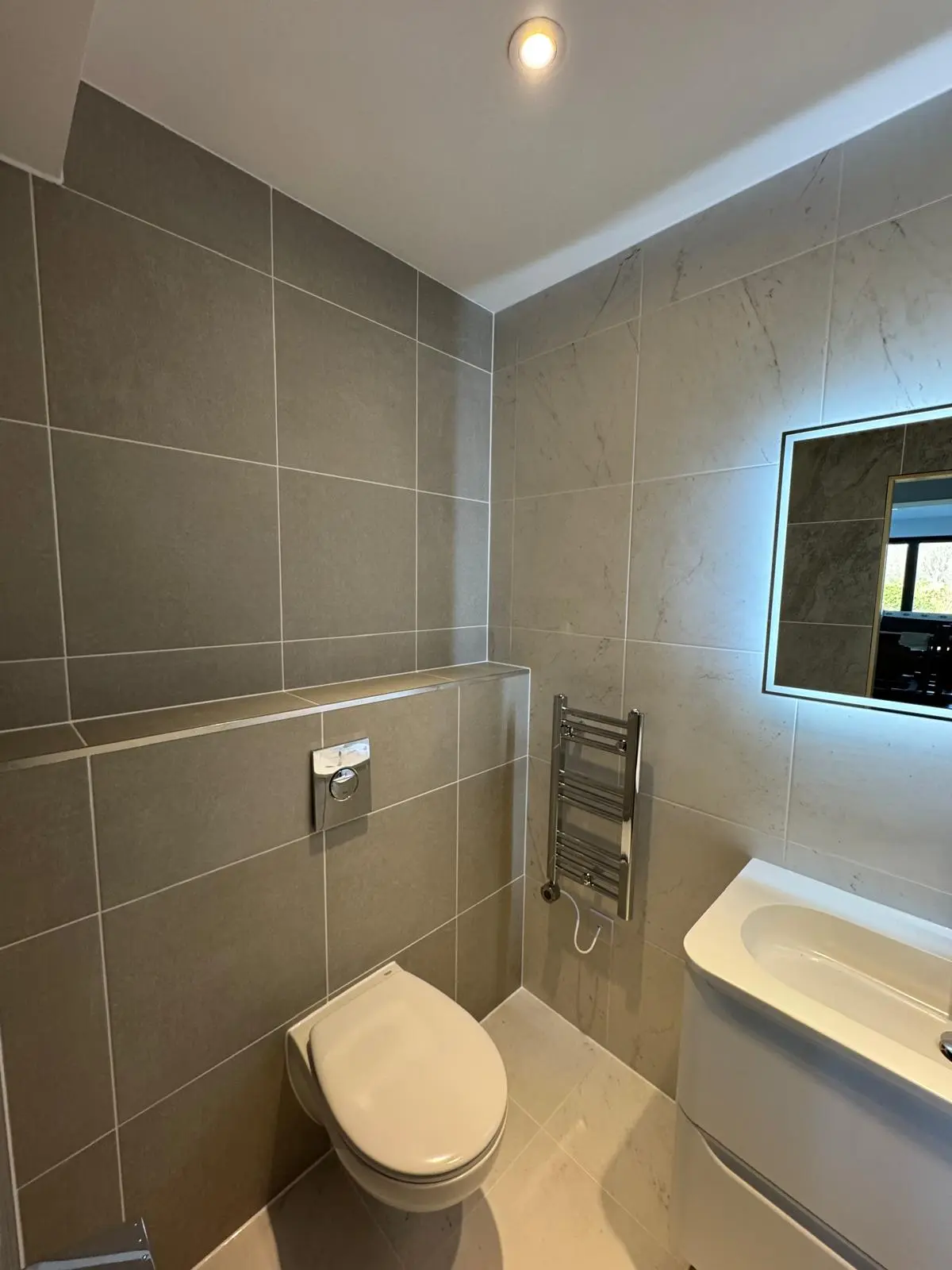 Completed tiled cloakroom and vanity